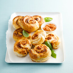 Puff pastry swirls with red pesto