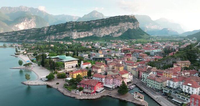 Aerial view Riva del Garda Italy. City streets at the foot of alpine mountains with houses, tourist landscapes. High quality 4k footage