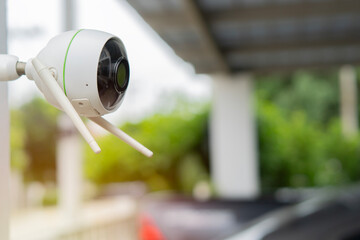 Surveillance camera monitor at garage at home with copy space. Safety house concept.
