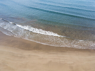 Drone point of view of desert beach and seashore on South of Tenerife in early morning