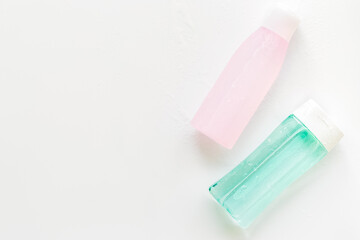 skin care cosmetics with facial tonic, mycelial water on white background top view mockup