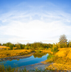 Fototapeta premium small lake among sandy prairie at the summer sunny day