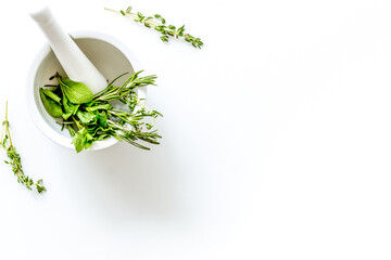 Homeopathy with leaves and healing herbs for making oil on white