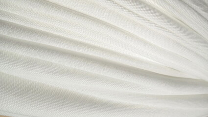 a close-up shot of a white, textured fabric
