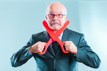 Worried businessman pressured to make unwanted cuts