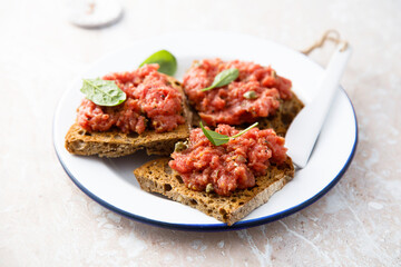 Traditional steak tartare on toast