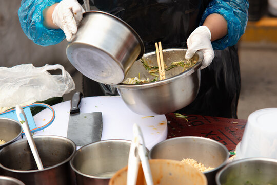 Making traditional summer food Liangpi