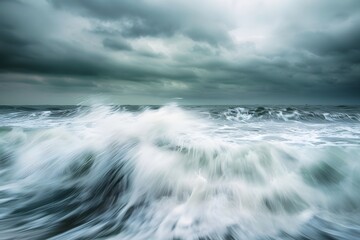 Fototapeta premium Moody ocean waves crashing under a stormy sky.