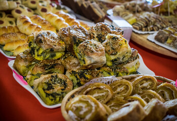 A variety of different pies and other pastries set on a table
