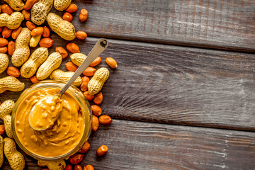 peanut butter for cooking breakfast at home on wooden background