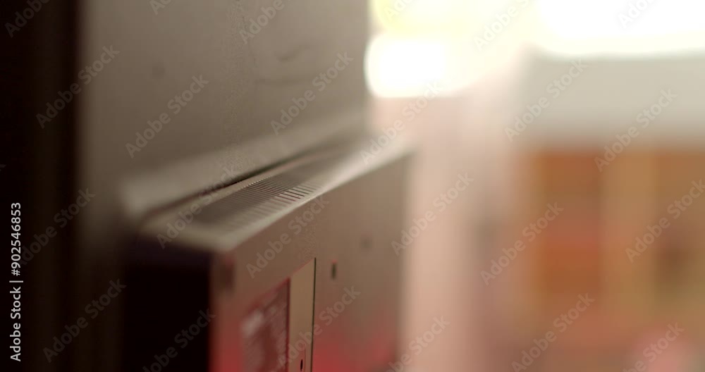 Poster closeup of electronic device with ambient lighting, showing unplugged cables for a modern and profes