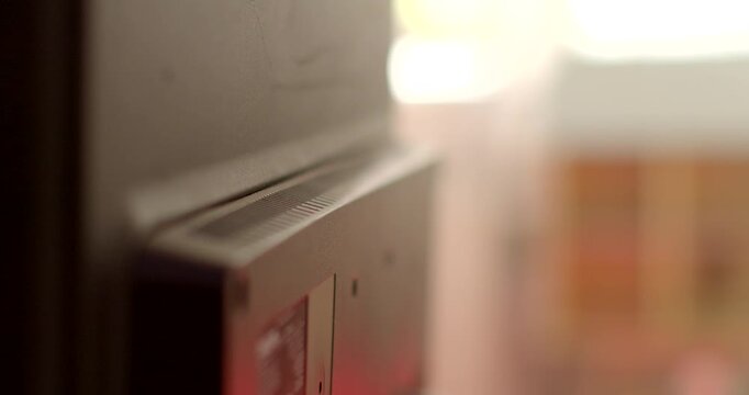 Closeup of electronic device with ambient lighting, showing unplugged cables for a modern and professional setup
