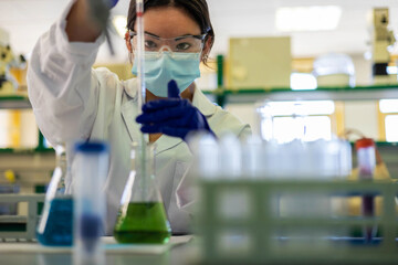 a scientist in the lab doing an experiment