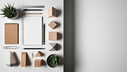 Modern Workspace Flat Lay Setup with Minimalist Aesthetic, Including Notebook, Plant, and Geometric Decor