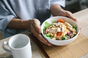 Man Hands Holding Fresh Salad In The Bowl