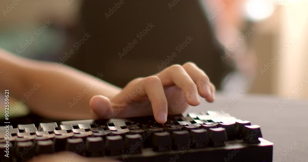 Poster a close-up shot of a person's hand typing on a mechanical keyboard. ideal for tech and games-related