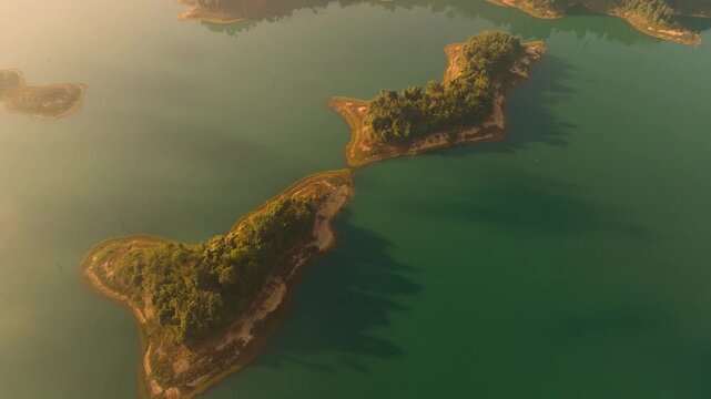 4K aerial drone footage of small islands in Kao Sok National Park during a sunrise, Thailand, Asia