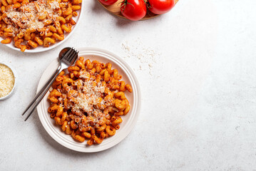 Cavatappi pasta with tomato sauce and grated parmesan cheese