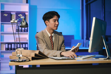 Business man working at office with laptop and documents on desk, financial adviser analyzing data, employees working overtime.