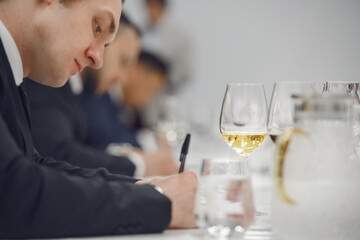 Sommelier degustate wine. Sommelier examination to get certificate professional work of winemaking. 