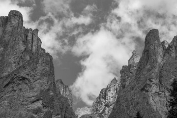 dramatic sky on mountain peaks of Sassolungo in italian alps