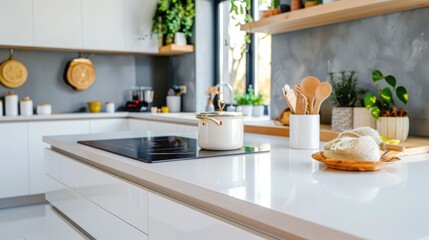 Fototapeta premium Photograph showcasing a contemporary and well organized kitchen setup featuring light colored countertops and an elegant arrangement of cooking utensils on display