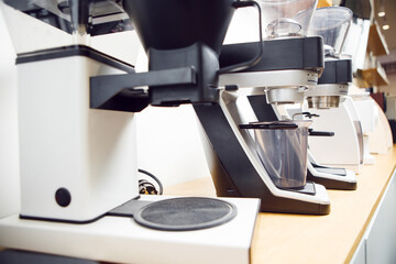 Array of Professional Electric Coffee Grinders at Modern Cafe