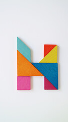 Tangram puzzle alphabet concept letter