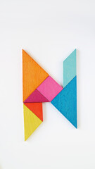 Tangram puzzle alphabet concept letter