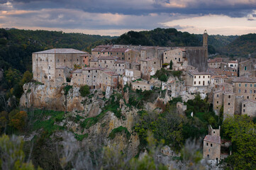 Fototapeta premium View of Sorano, an ancient medieval hill town composed of tuff stone over the Lente River. Etruscan town. Province Grosseto, Tuscany, Italy.