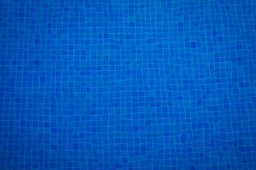 Swimming pool bottom caustics ripple and flow with waves background. Summer background. Texture of water surface. Overhead view