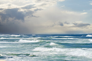 Waves, ocean and coastal scenery with shore and horizon for peace, travel destination and holiday location. Seascape, cloudy sky or sea water for vacation landscape, panorama or environment in nature