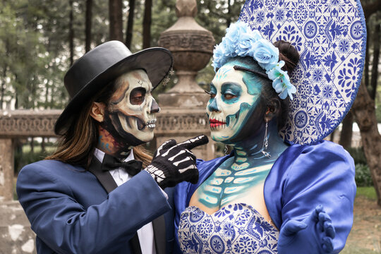 Celebrating Day of the Dead with traditional Catrinas in Mexico