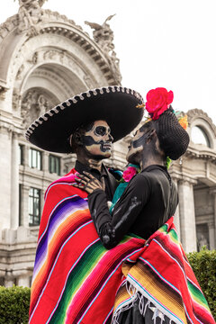 Catrinas celebrating Day of the Dead in traditional garb