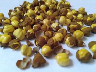 Close up of roasted gram or bhuna chana on white background