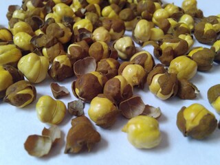 Close up of roasted gram or bhuna chana on white background