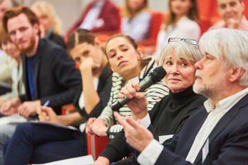 Audience answering during business event in convention center
