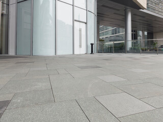 empty concrete ground in front of modern office buildings in downtown. floor for copy space.