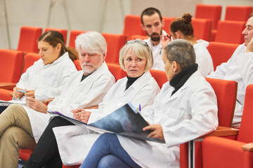Doctors with x-ray discussing in medical conference event