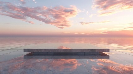 A large, empty table is set on a beach with a beautiful sunset in the background