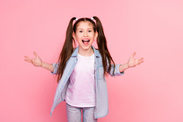 Photo of cute small girl with long ponytails dressed denim shirt loudly screaming staring at sale isolated on pink color background