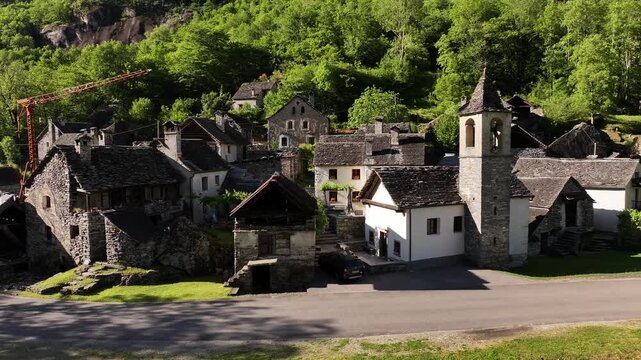 Charming aerial of traditional village nestled in Maggiatal Vallemaggia, Ticino, Switzerland