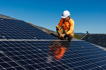 Solar panel technician with power meter and solar panels