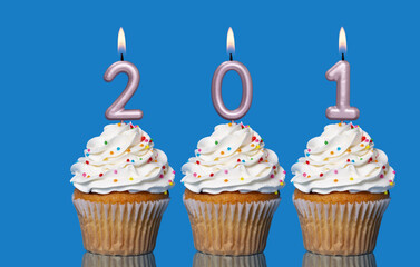Birthday Cupcakes With Candles Lit Forming The Number 201