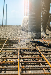 Iron grate or reinforcement on the ground poured with concrete at a construction site