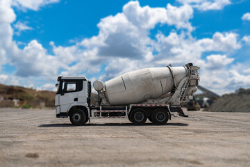 Concrete Truck or Cement mixer Industrial Machinery at Work as Cement Mixer Truck Heads to Construction Zone