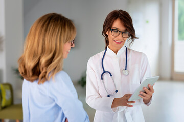 Female doctor consulting with her patient at the clinic