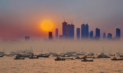 Air pollution concept - Modern highrise rich buildings and poor slums at sunset - Mumbai, india 