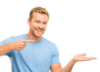 Presentation, pointing and portrait of man in studio for promotion, news and announcement. Advertising, happy and isolated person with hand gesture for discount, deal and bargain on white background