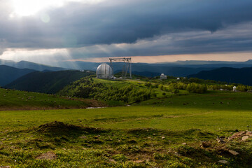Large observatory dome with a metal crane structure.